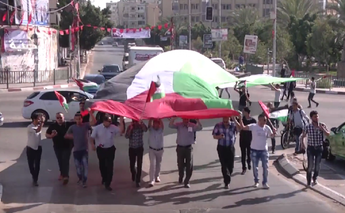 غزة: مسيرة بالعلم الفلسطيني للمطالبة بإنهاء الانقسام