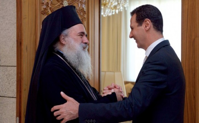 المطران حنا والرئيس السوري بشار الأسد خلال اللقاء غير المعلن