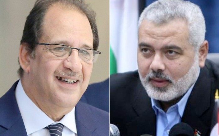 رئيس المكتب السياسي لحركة حماس إسماعيل هنية (يمينًا) ووزير المخابرات المصرية اللواء عباس كامل (أرشيف)